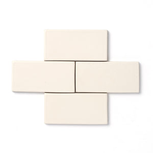 Reminiscent of ancient alabaster sculptures, this soft white glaze is consistent in both color and surface texture and presents an opaque break on relief details as well as the tile edge.