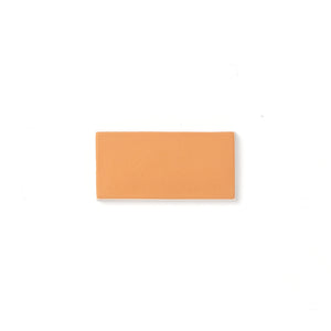 This smooth matte glaze features a slight variation in its mature golden yellow hue that typically breaks opaque around tile edges and relief detailing.