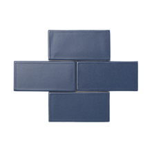 Load image into Gallery viewer, The ultimate navy blue, Orion is a smooth matte glaze that has a slight variation in color and texture and presents an opaque break on tile edges and relief details.
