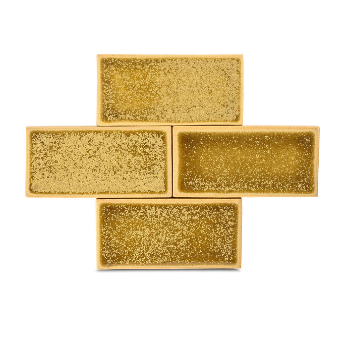 This lively yellow-gold dazzles any installation with variation that features flecks of burnt microcrystals which creep into view. Tuscan Gold is a predominantly glossy glaze with areas of matted surface texture. 