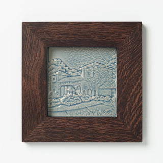 Decorative ceramic tile in blue glaze of Cincinnati Coney Island in Walnut Frame