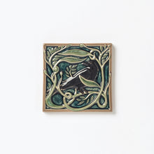 Load image into Gallery viewer, Decorative ceramic tile with Rook or Crow in center surrounded by leaves.
