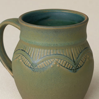 Close-up details of hand-thrown mug by Rookwood