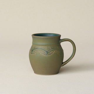Hand-thrown ceramic mug by Rookwood Pottery