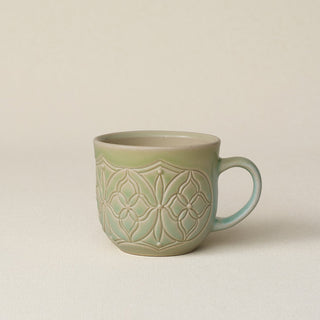 Hand-thrown ceramic mug by Rookwood Pottery