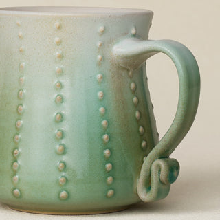 Close-up details of hand-thrown mug by Rookwood