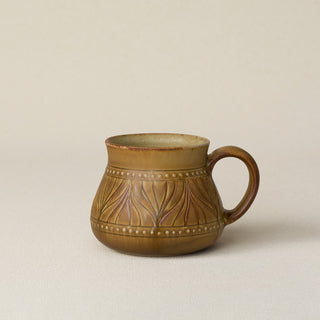 Hand-thrown ceramic mug by Rookwood Pottery
