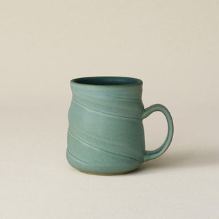 Hand-thrown ceramic mug by Rookwood Pottery