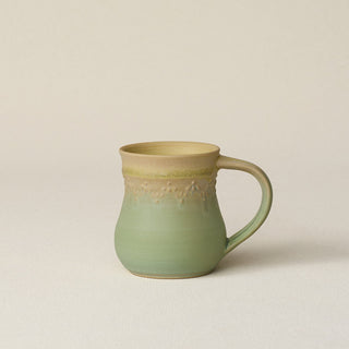 Hand-thrown ceramic mug by Rookwood Pottery