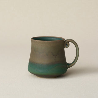 Hand-thrown ceramic mug by Rookwood Pottery