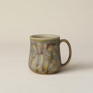 Hand-thrown ceramic mug by Rookwood Pottery
