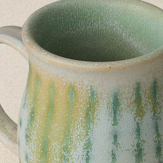 Close-up details of hand-thrown mug by Rookwood