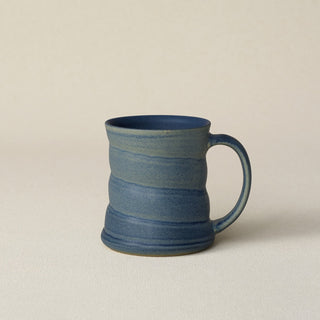 Hand-thrown ceramic mug by Rookwood Pottery
