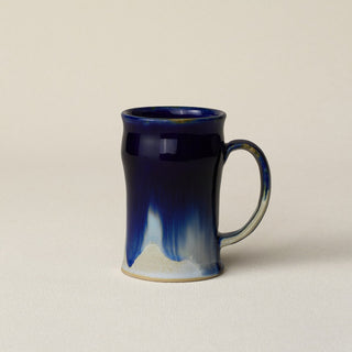 Hand-thrown ceramic mug by Rookwood Pottery