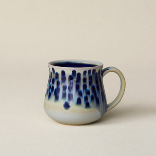 Hand-thrown ceramic mug by Rookwood Pottery