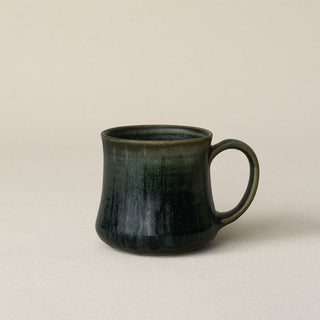 Hand-thrown ceramic mug by Rookwood Pottery