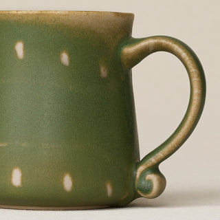 Close-up details of hand-thrown mug by Rookwood