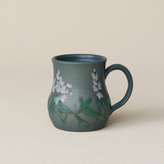 Hand-thrown ceramic mug by Rookwood Pottery