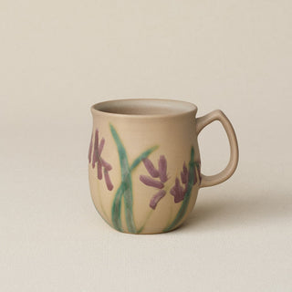 Hand-thrown ceramic mug by Rookwood Pottery