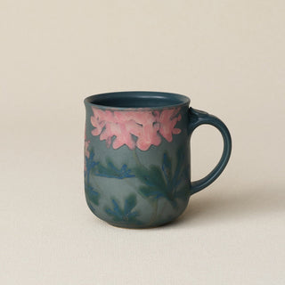 Hand-thrown ceramic mug by Rookwood Pottery