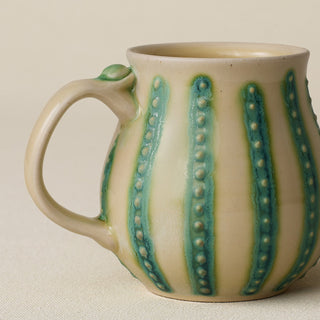 Close-up details of hand-thrown mug by Rookwood
