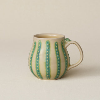 Hand-thrown ceramic mug by Rookwood Pottery