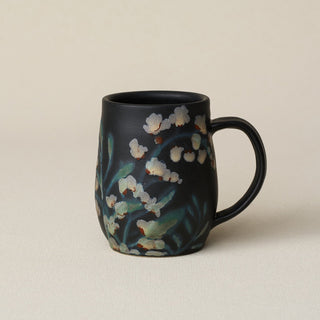 Hand-thrown ceramic mug by Rookwood Pottery