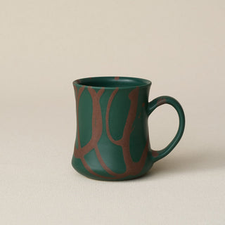 Hand-thrown ceramic mug by Rookwood Pottery