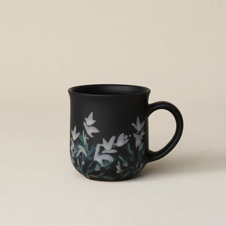 Hand-thrown ceramic mug by Rookwood Pottery