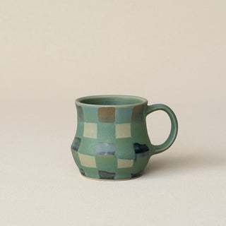 Hand-thrown ceramic mug by Rookwood Pottery