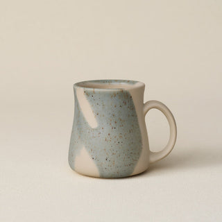 Hand-thrown ceramic mug by Rookwood Pottery