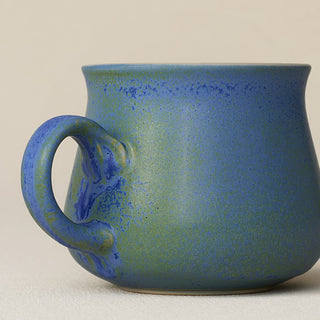 Close-up details of hand-thrown mug by Rookwood