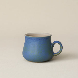 Hand-thrown ceramic mug by Rookwood Pottery