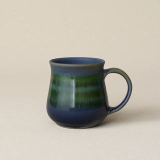 Hand-thrown ceramic mug by Rookwood Pottery