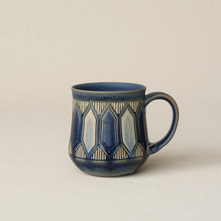 Hand-thrown ceramic mug by Rookwood Pottery
