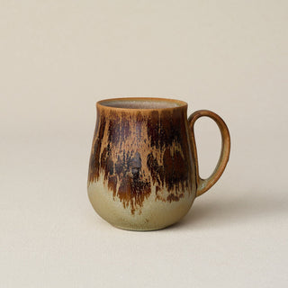 Hand-thrown ceramic mug by Rookwood Pottery
