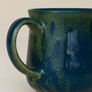 Close-up details of hand-thrown mug by Rookwood