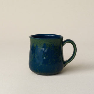 Hand-thrown ceramic mug by Rookwood Pottery