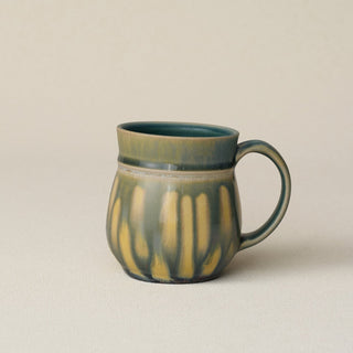 Hand-thrown ceramic mug by Rookwood Pottery