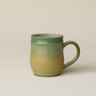 Hand-thrown ceramic mug by Rookwood Pottery