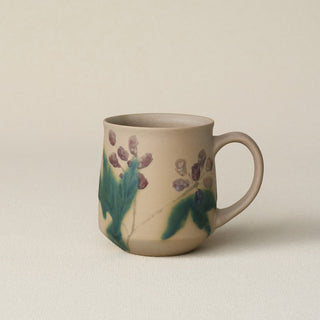 Hand-thrown ceramic mug by Rookwood Pottery