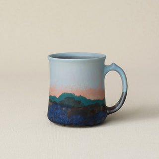 Hand-thrown ceramic mug by Rookwood Pottery