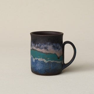 Hand-thrown ceramic mug by Rookwood Pottery