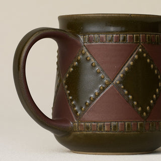 Close-up details of hand-thrown mug by Rookwood