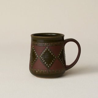 Hand-thrown ceramic mug by Rookwood Pottery