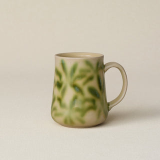 Hand-thrown ceramic mug by Rookwood Pottery