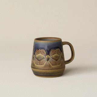 Hand-thrown ceramic mug by Rookwood Pottery