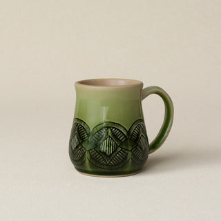 Hand-thrown ceramic mug by Rookwood Pottery