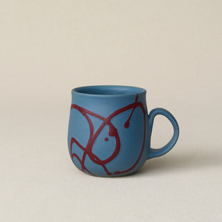 Hand-thrown ceramic mug by Rookwood Pottery
