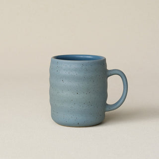 Hand-thrown ceramic mug by Rookwood Pottery